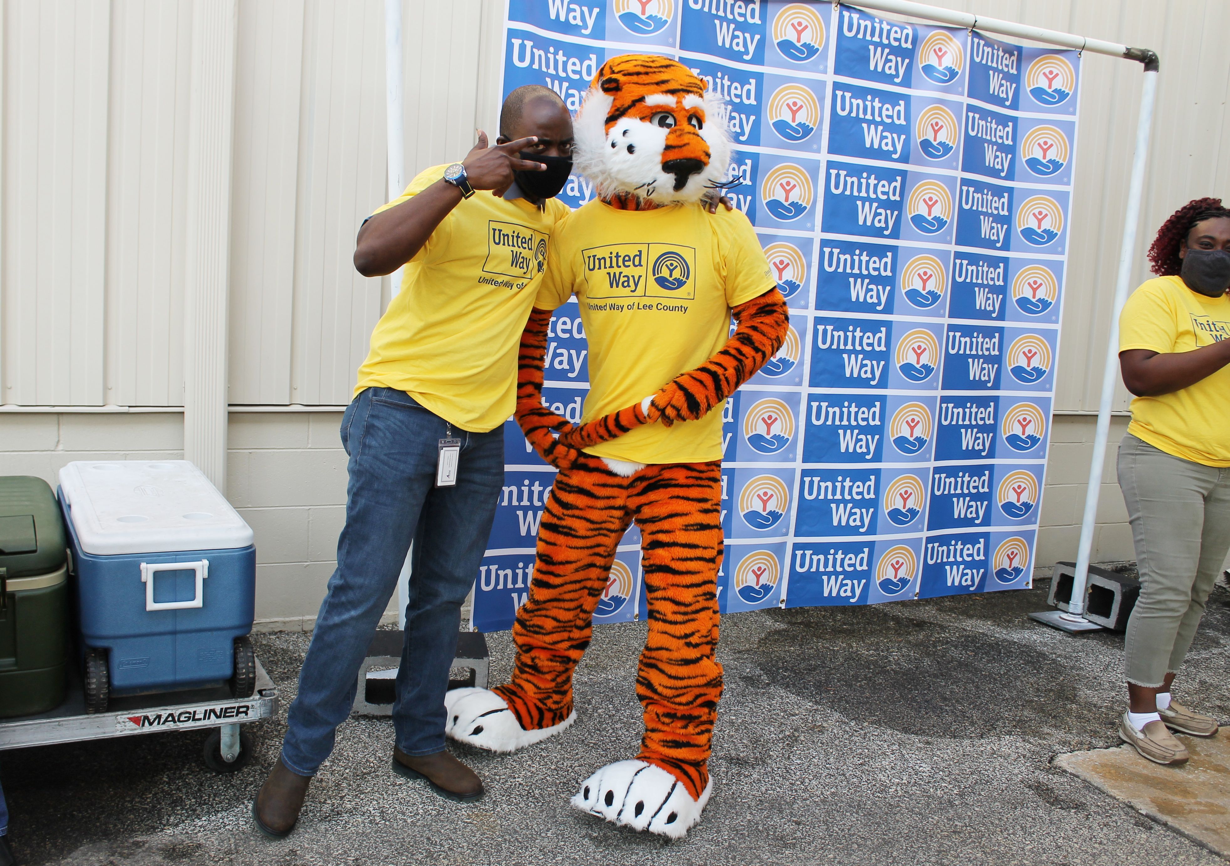 Aubie and volunteer