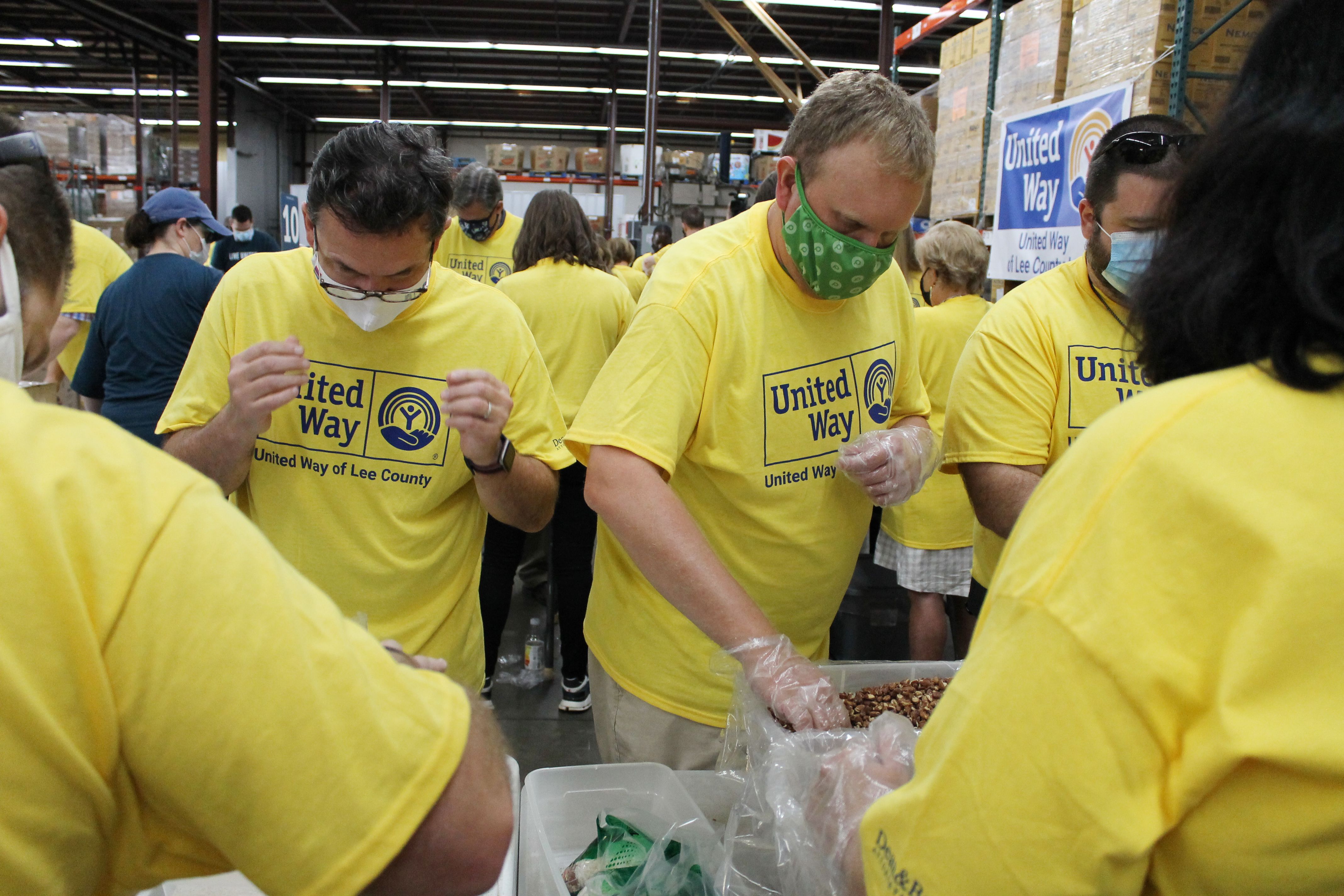 Volunteer packing food