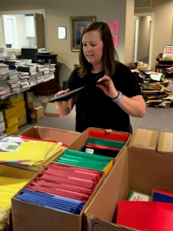 Volunteer packing backpacks