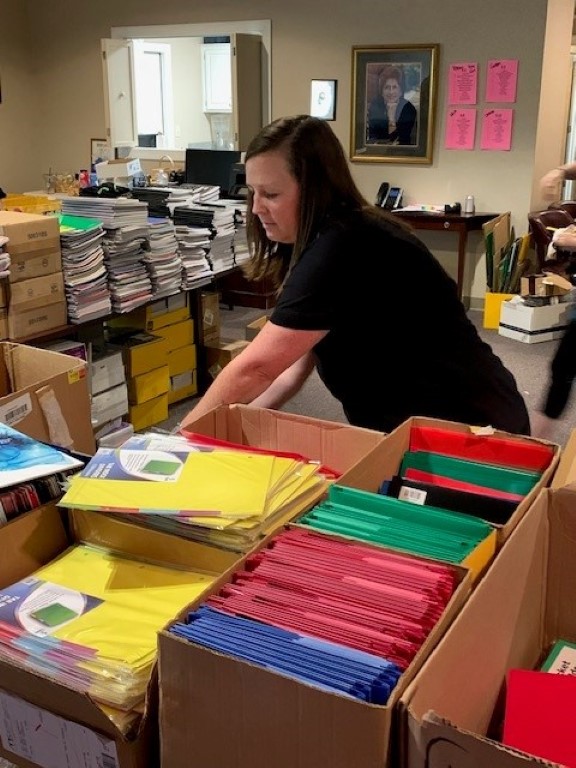 Volunteer packing backpacks