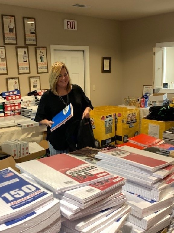 Volunteer packing backpacks