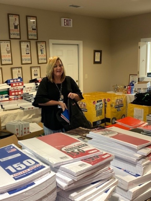 Volunteer packing backpacks