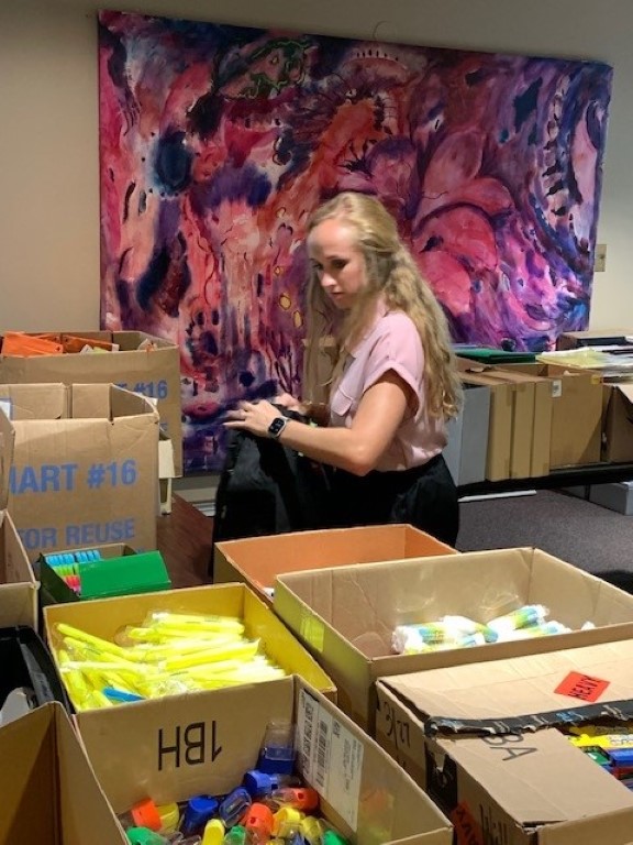 Volunteer packing backpacks