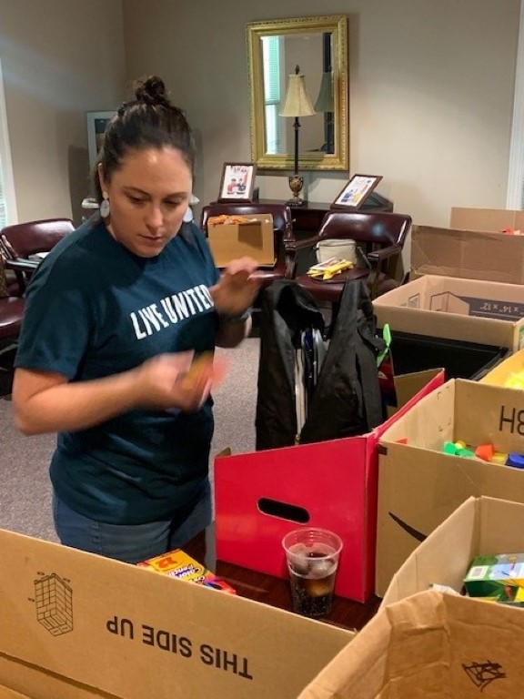 Volunteer packing backpacks