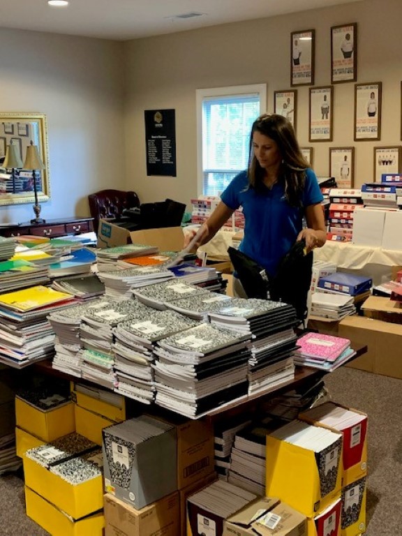 Volunteer packing backpacks