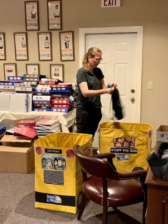 Volunteer packing backpacks