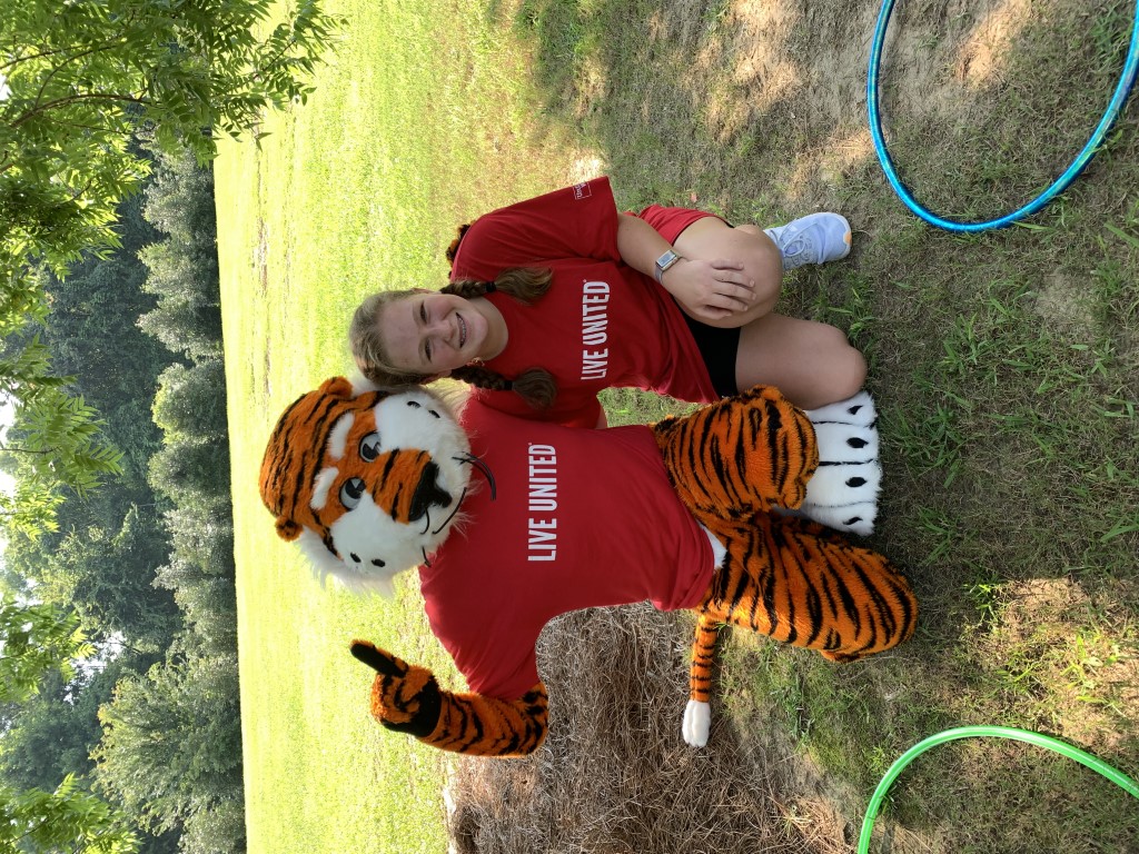 Aubie and volunteer