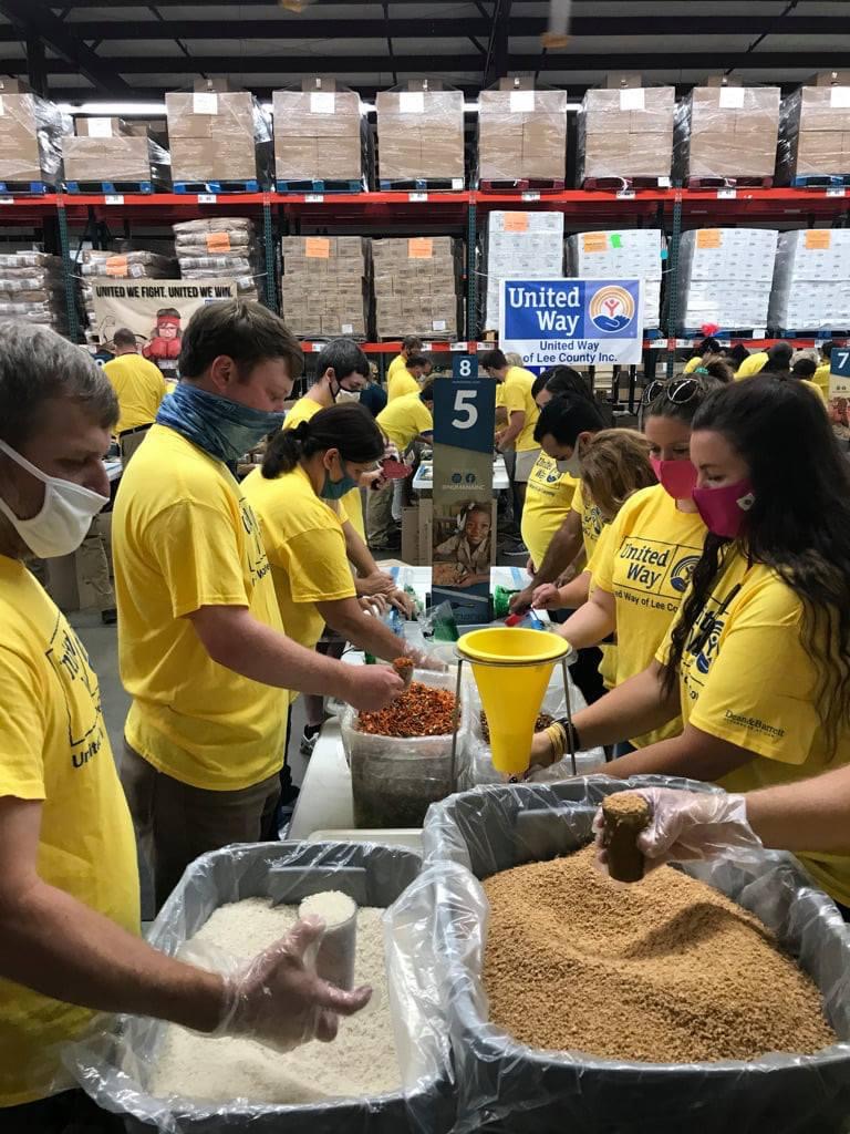 Volunteers packing food