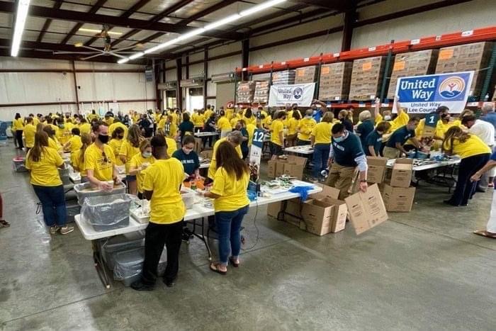 Volunteers packing food