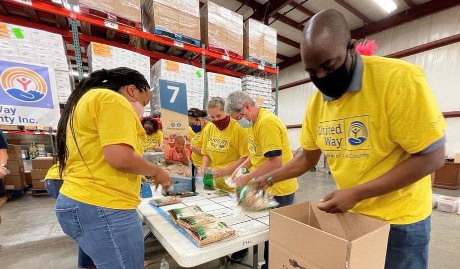 Volunteers packing food