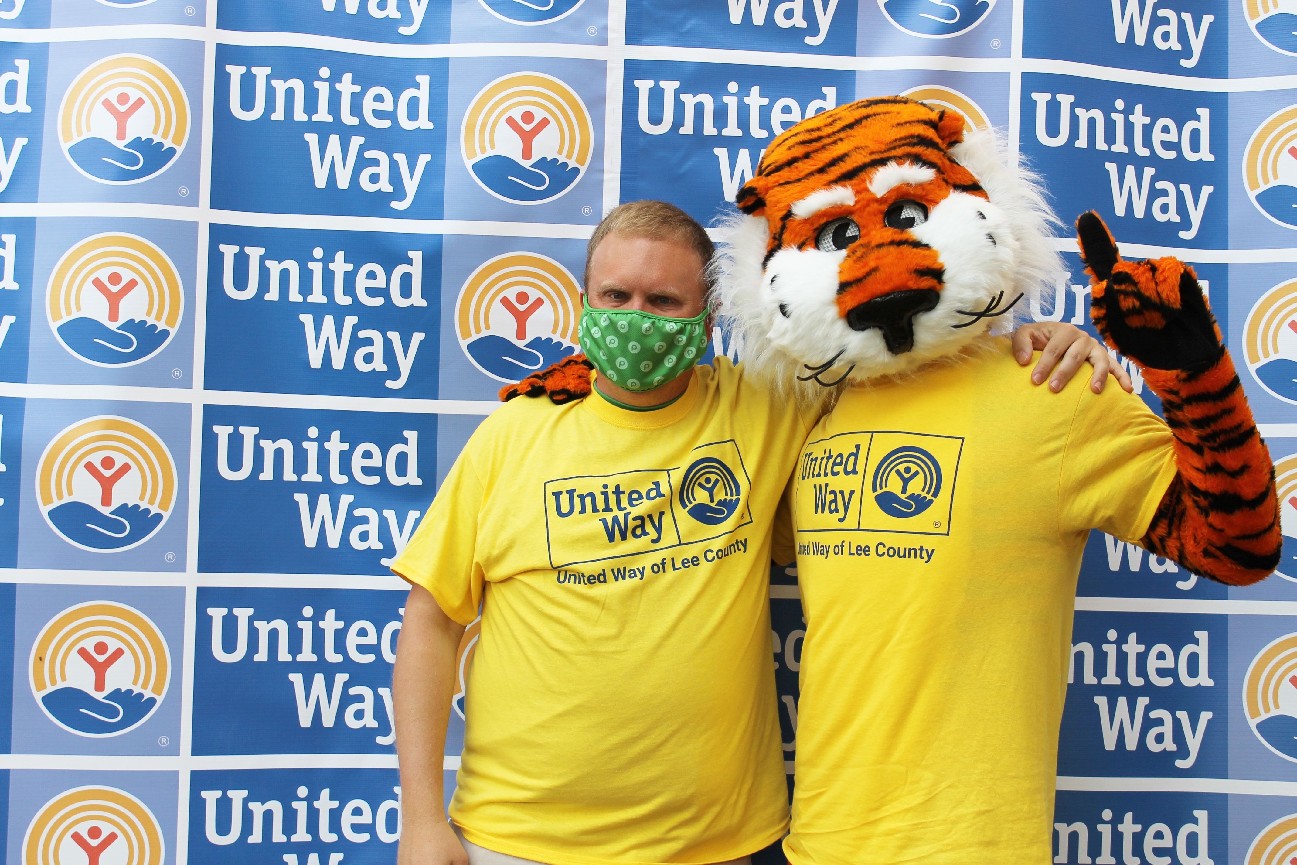 Aubie and a volunteer