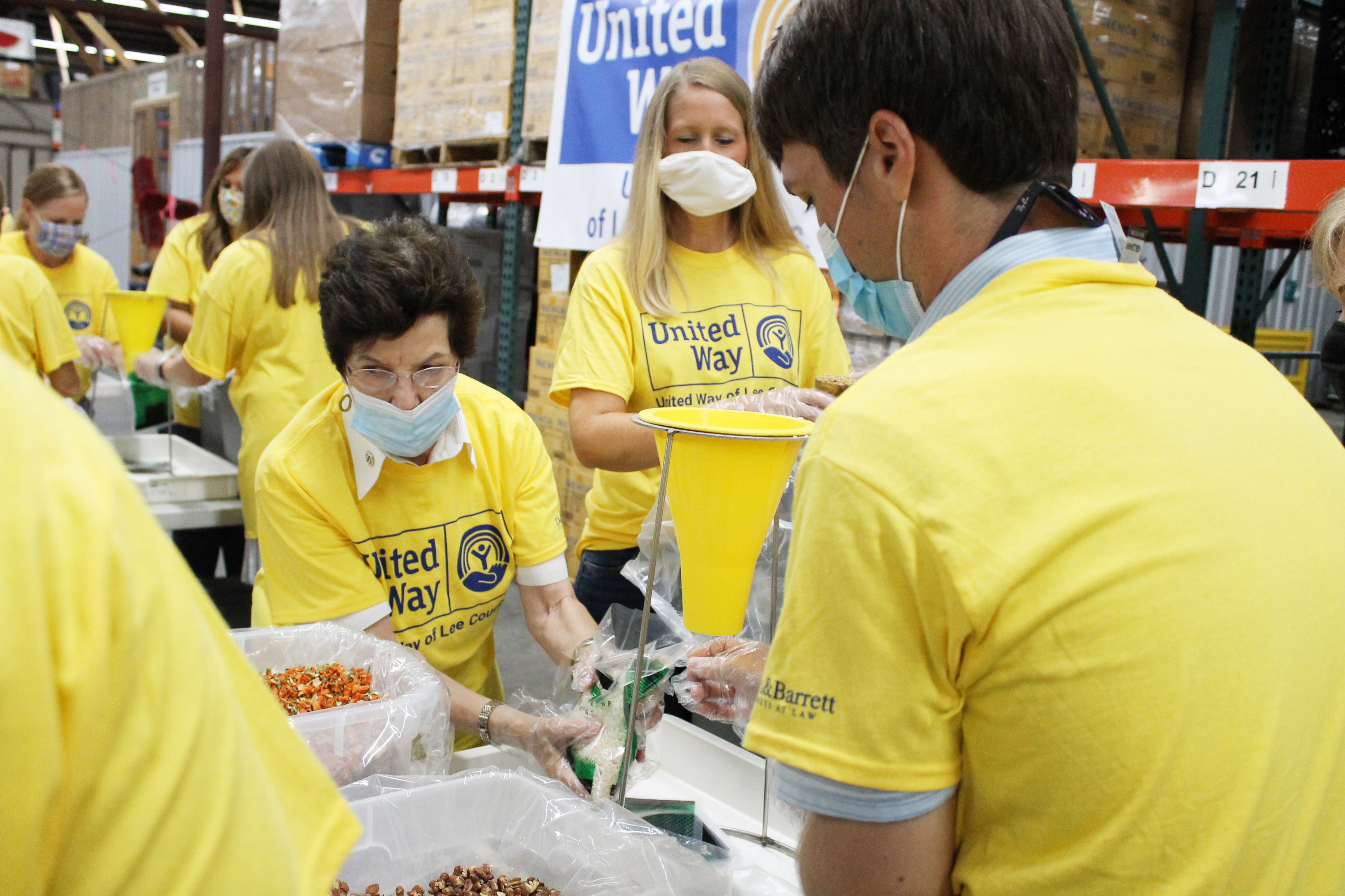 Volunteers packing food