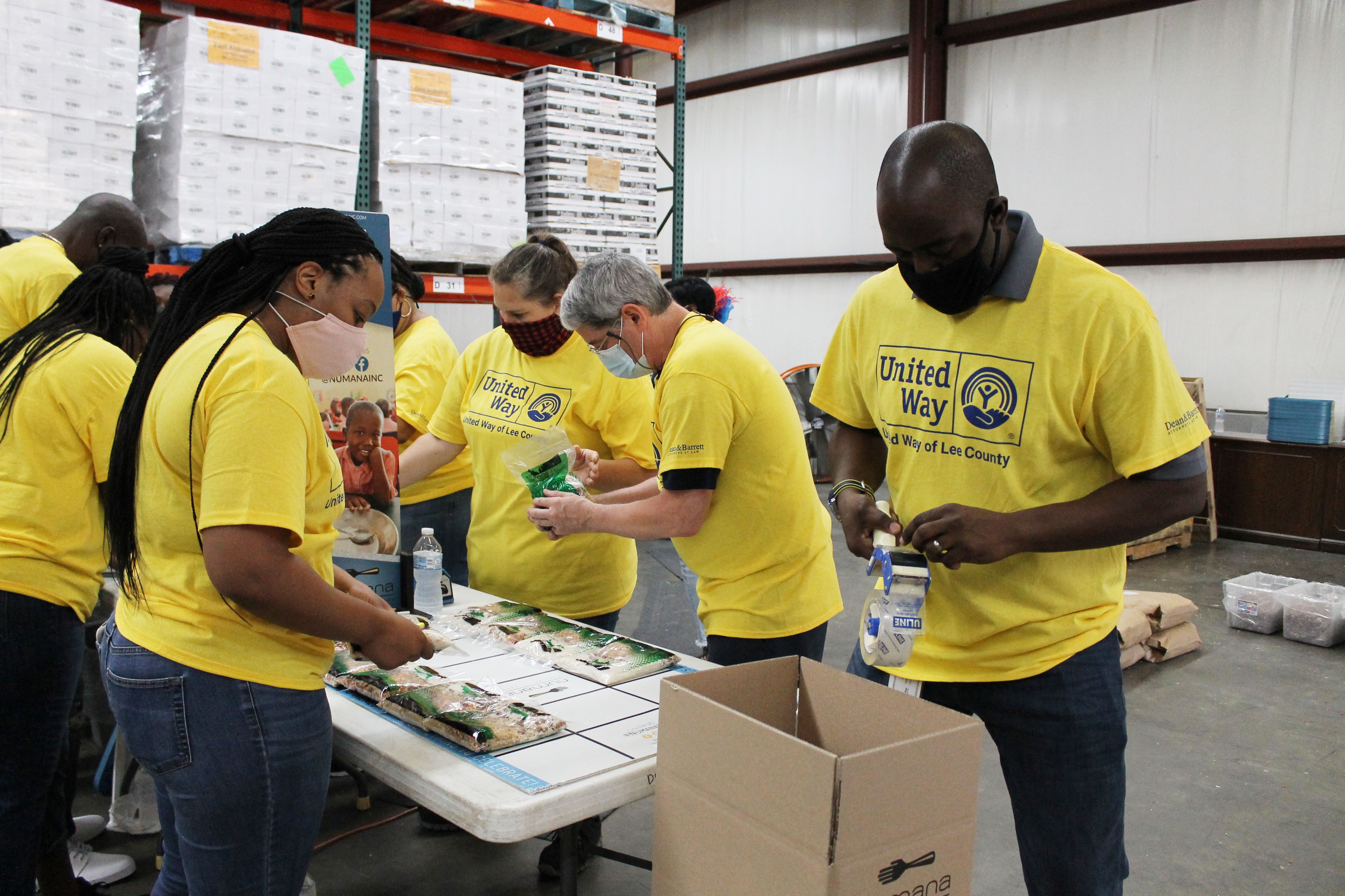 Volunteers packing food